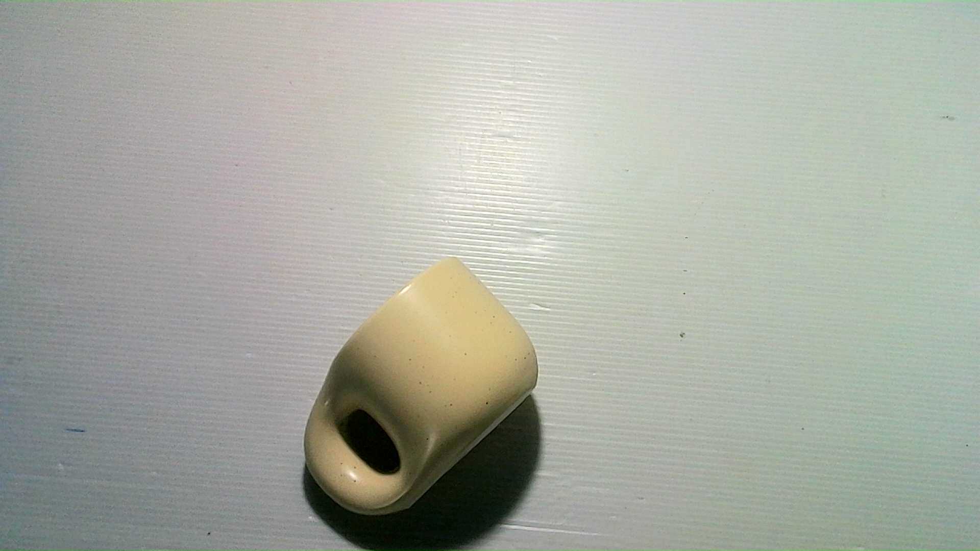 yellow ceramic cup