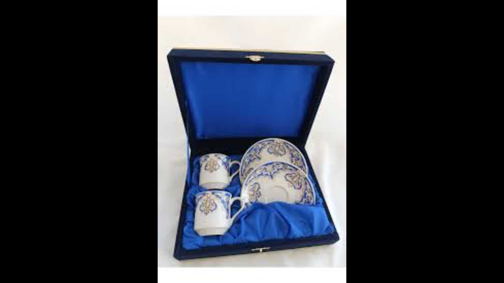 A set of two porcelain cups and plates in a velvet box.